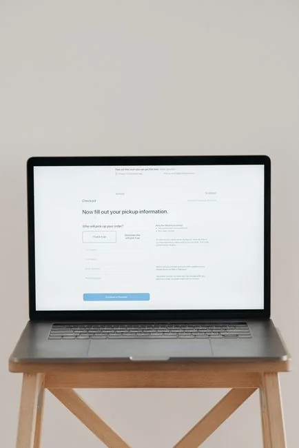 Close-up of a smartphone showing a billing app interface on a reflective surface.
